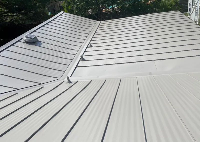 Solar attic fan installed on a metal roof for Roof Ventilation in North Fort Myers